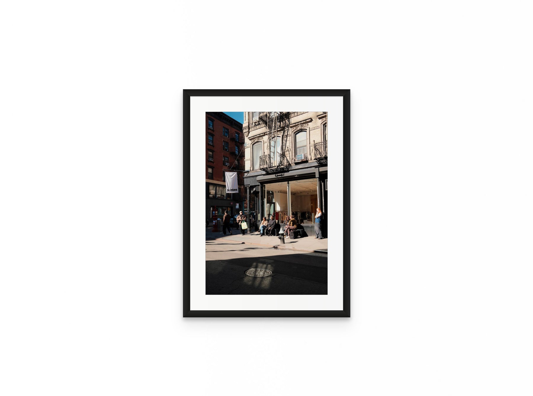 Nolita Corner Sun, 12×18 in black frame