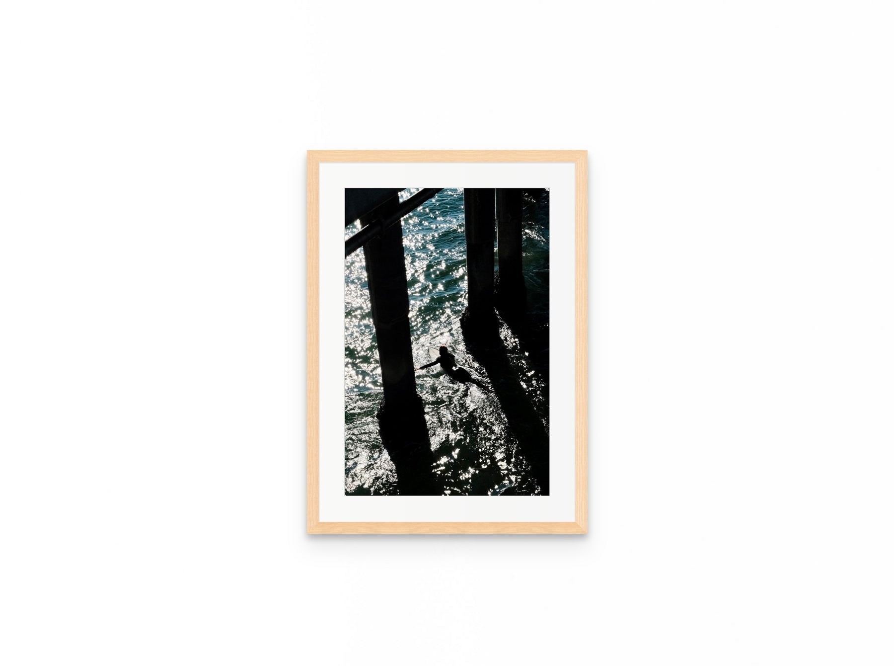 Pier Shadows Surfer, 12×18 in natural frame