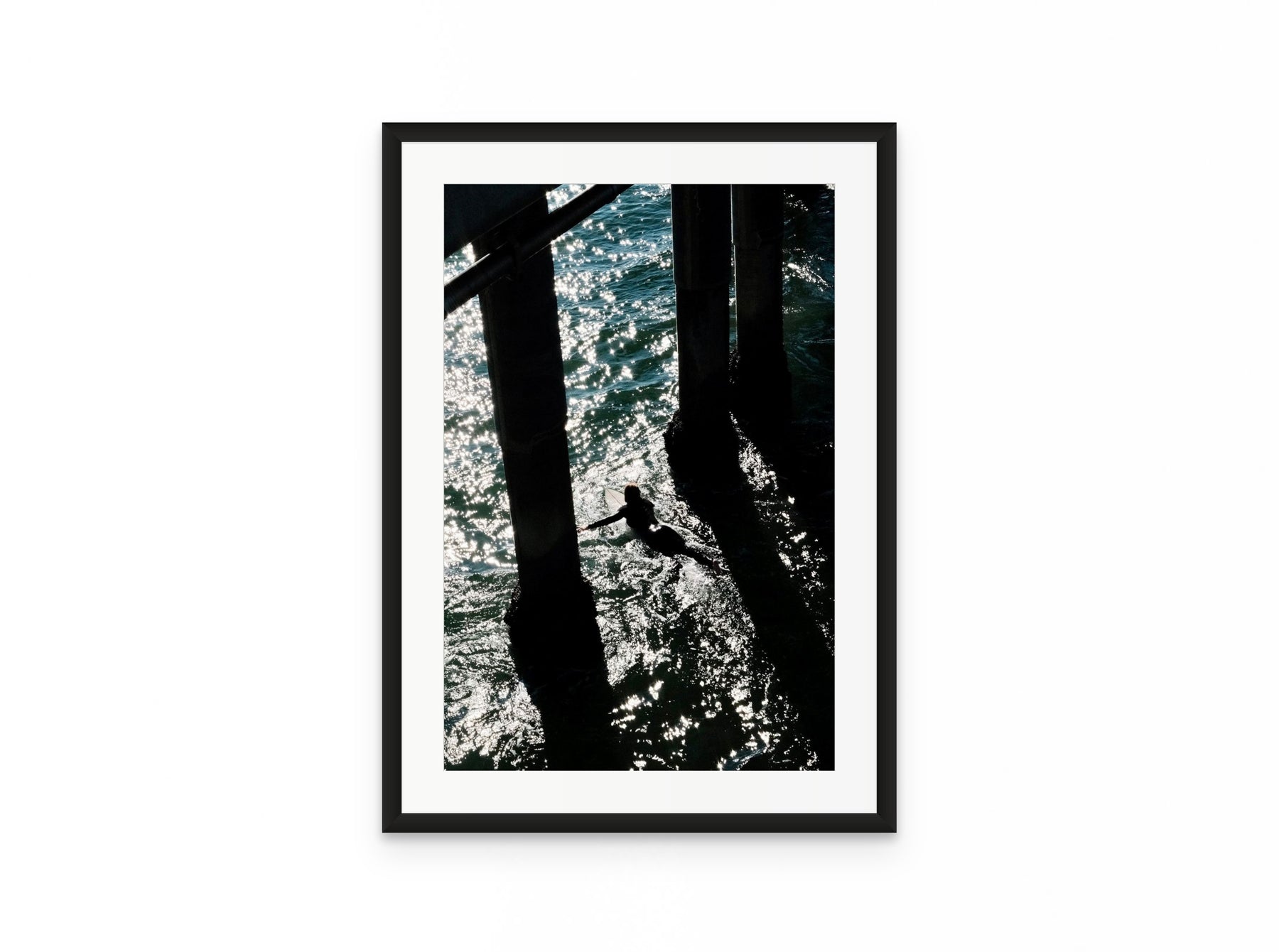 Pier Shadows Surfer, 16×24 in black frame