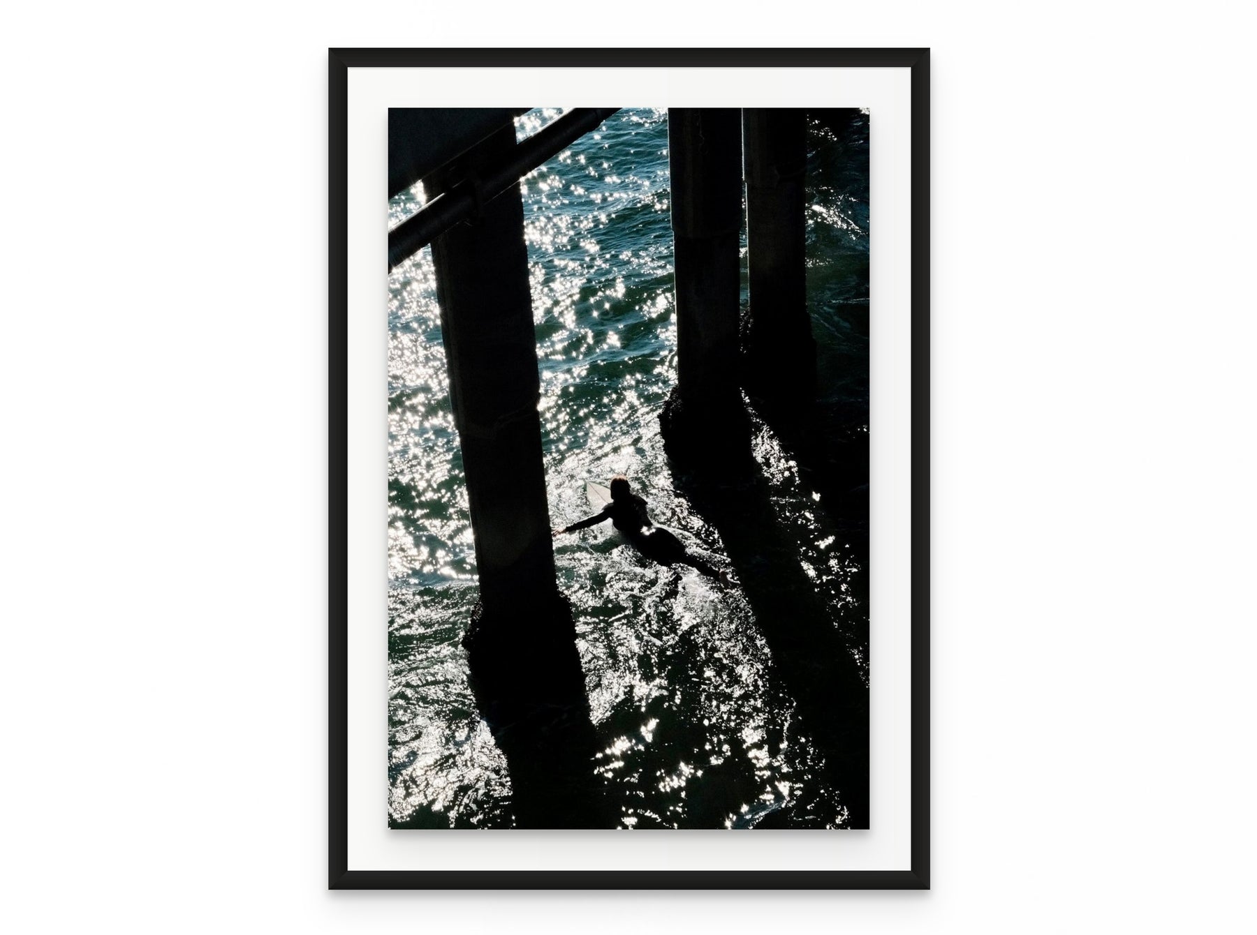 Pier Shadows Surfer, 20×30 in black frame