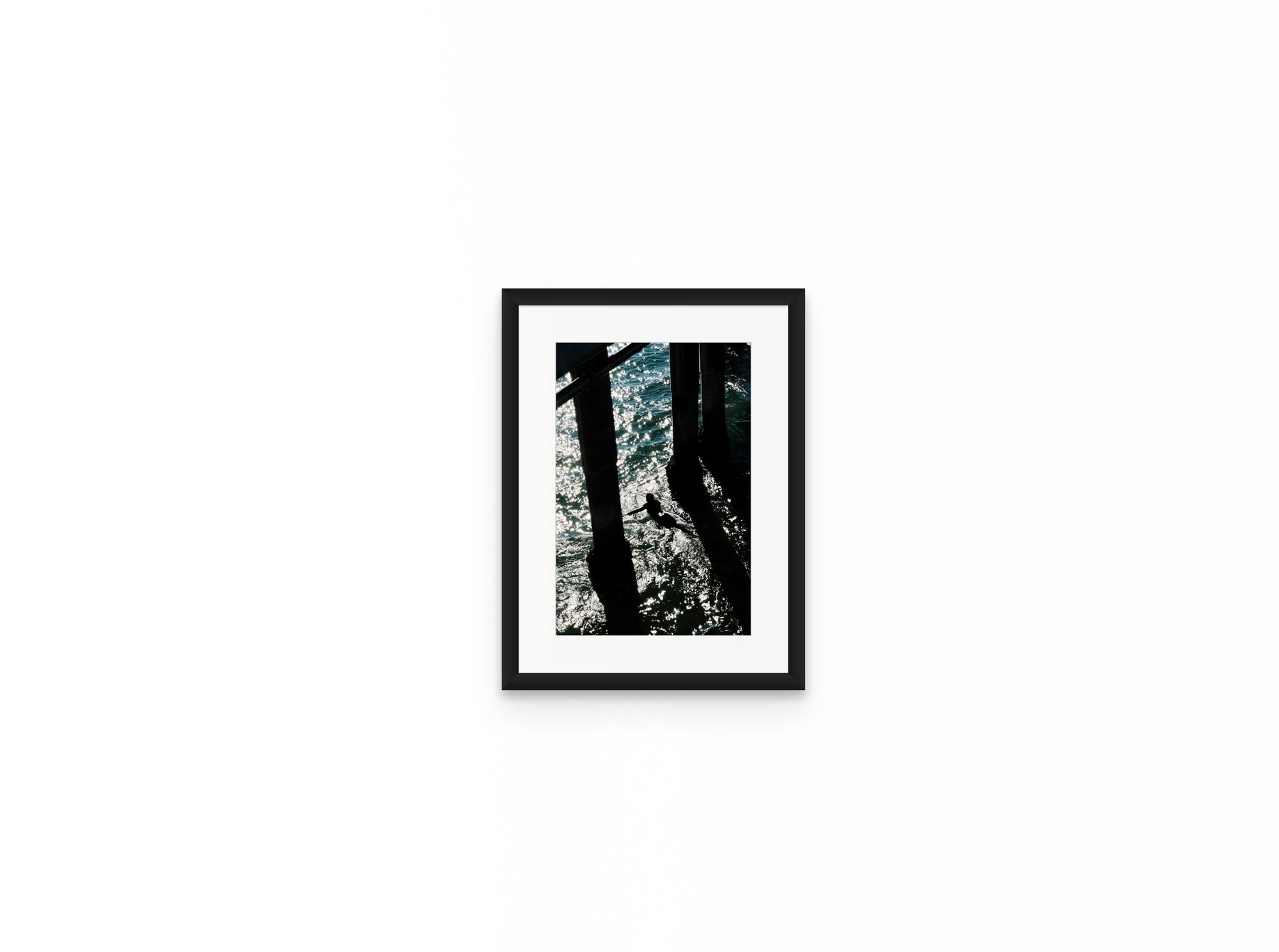Pier Shadows Surfer, 8×12 in black frame