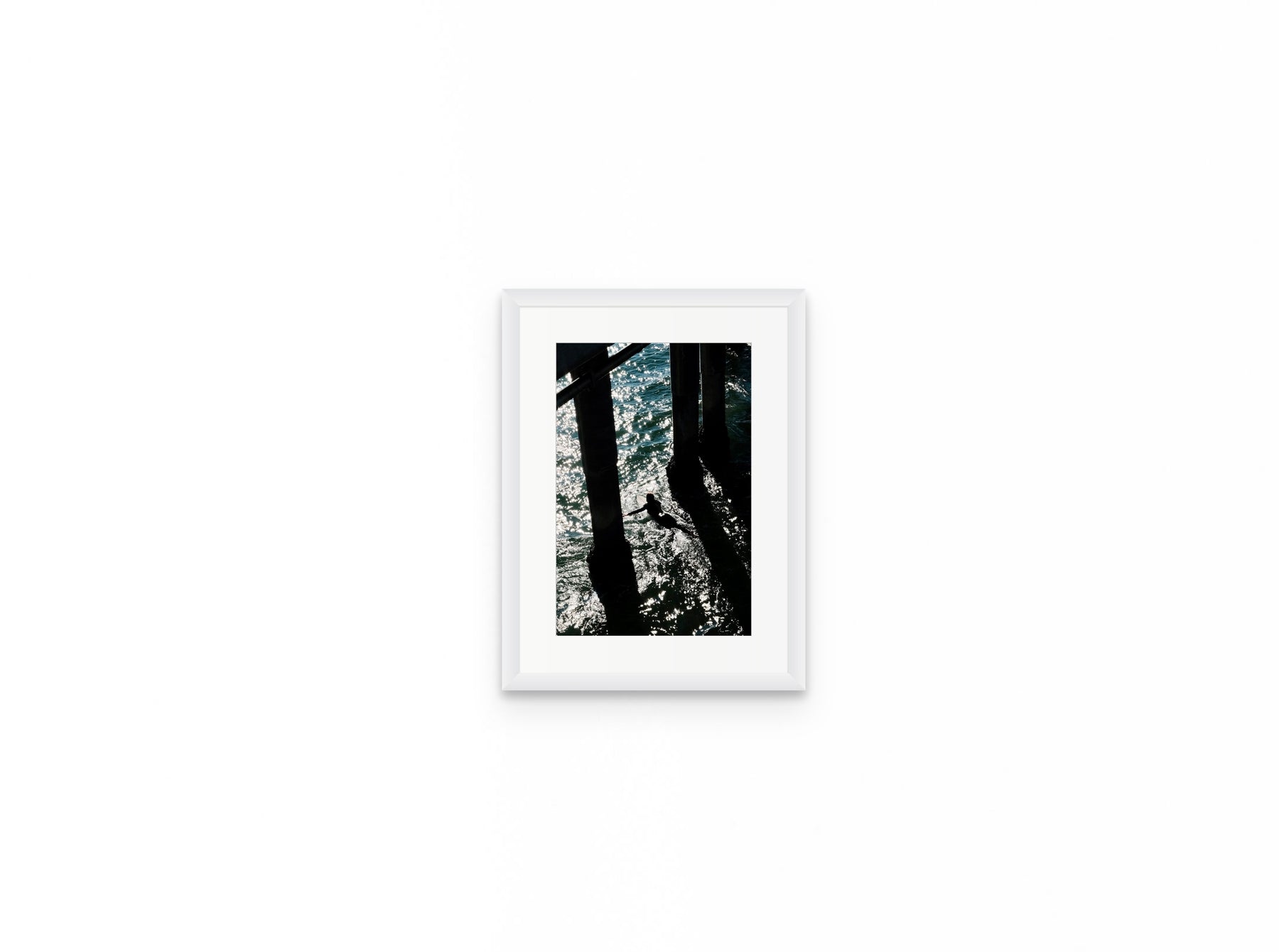 Pier Shadows Surfer, 8×12 in white frame